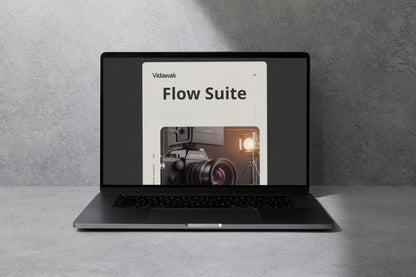 Laptop displaying 'Vidawak Flow Suite' on a gray surface with a gray background