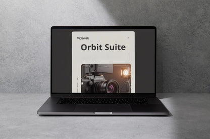 Laptop displaying the 'Vidwalk Orbit Suite' on a gray surface with a gray background